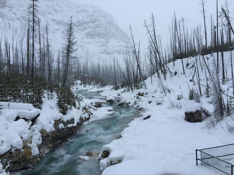 From Banff: Marble & Johnston Canyon Icewalk Combo - Ice cleats, trekking poles, and the warm-up break that keeps you moving